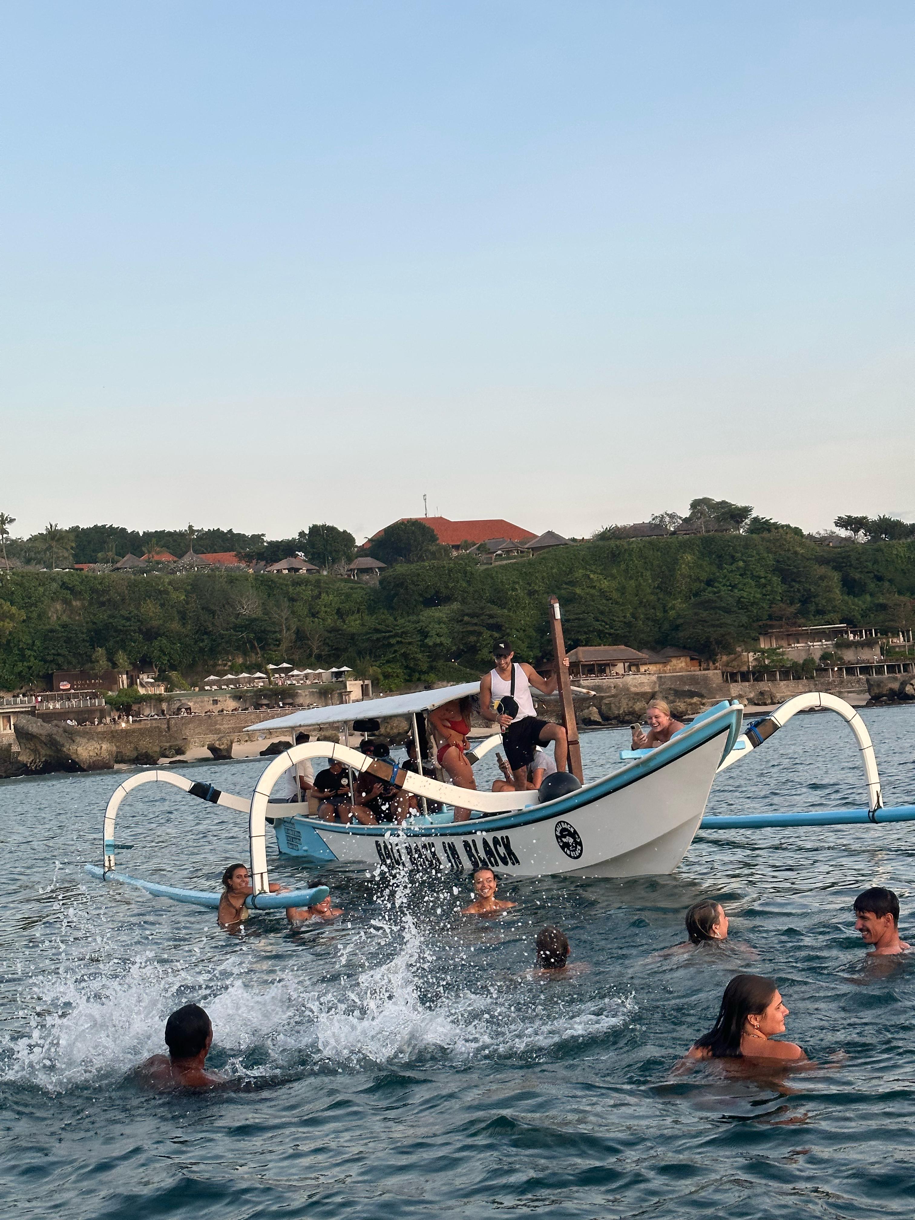 Guest snorkeling in clear water near the boat